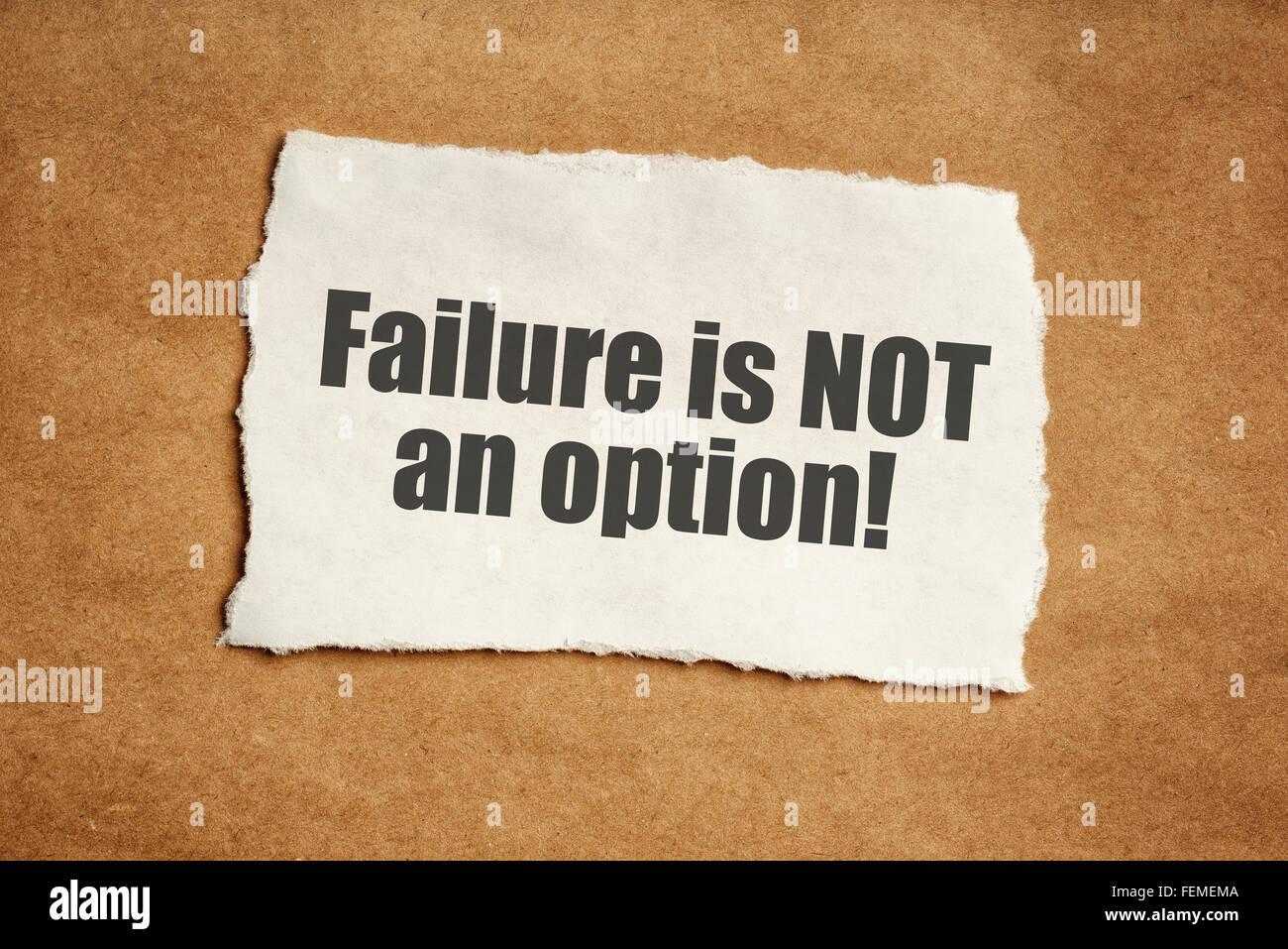 Failure is not an option motivational message on piece of scrap paper Stock Photo