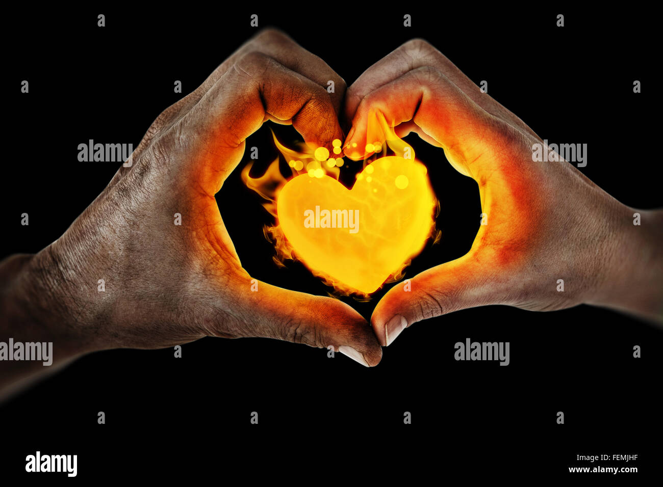 Composite image of couple making heart shape with hands Stock Photo - Alamy