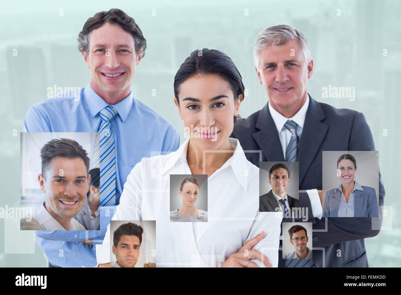Composite image of smiling business people brainstorming together Stock Photo