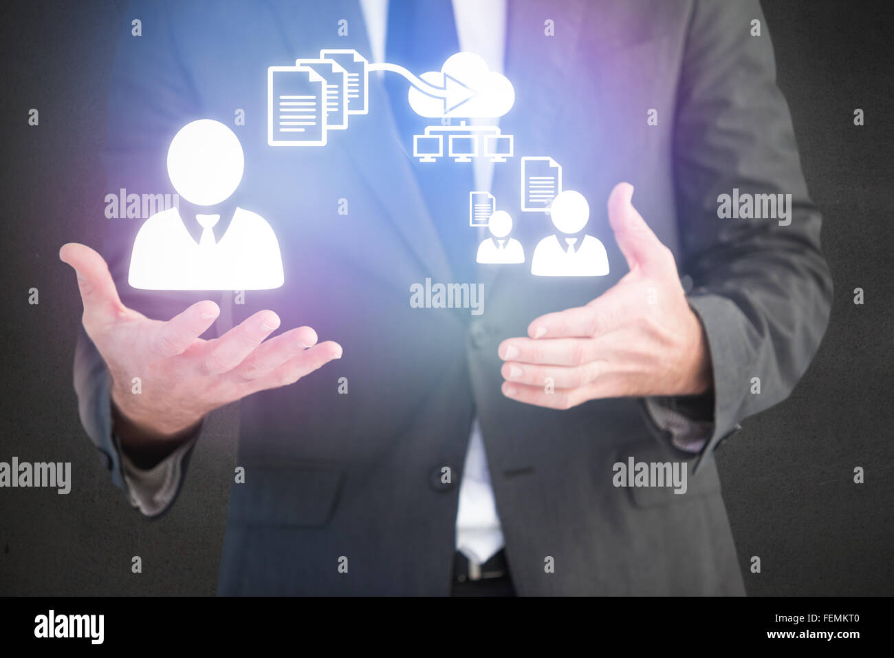 Composite image of handsome businessman presenting with hands Stock Photo