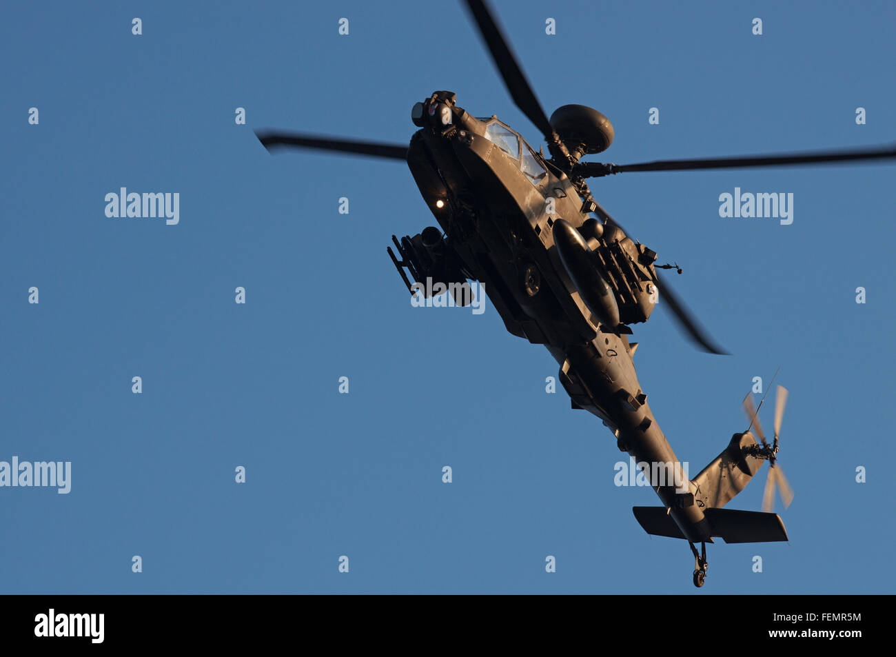 AgustaWestland Apache attack helicopter flown by the British Army Air Corps on a training mission over Woodbridge airfield. Stock Photo