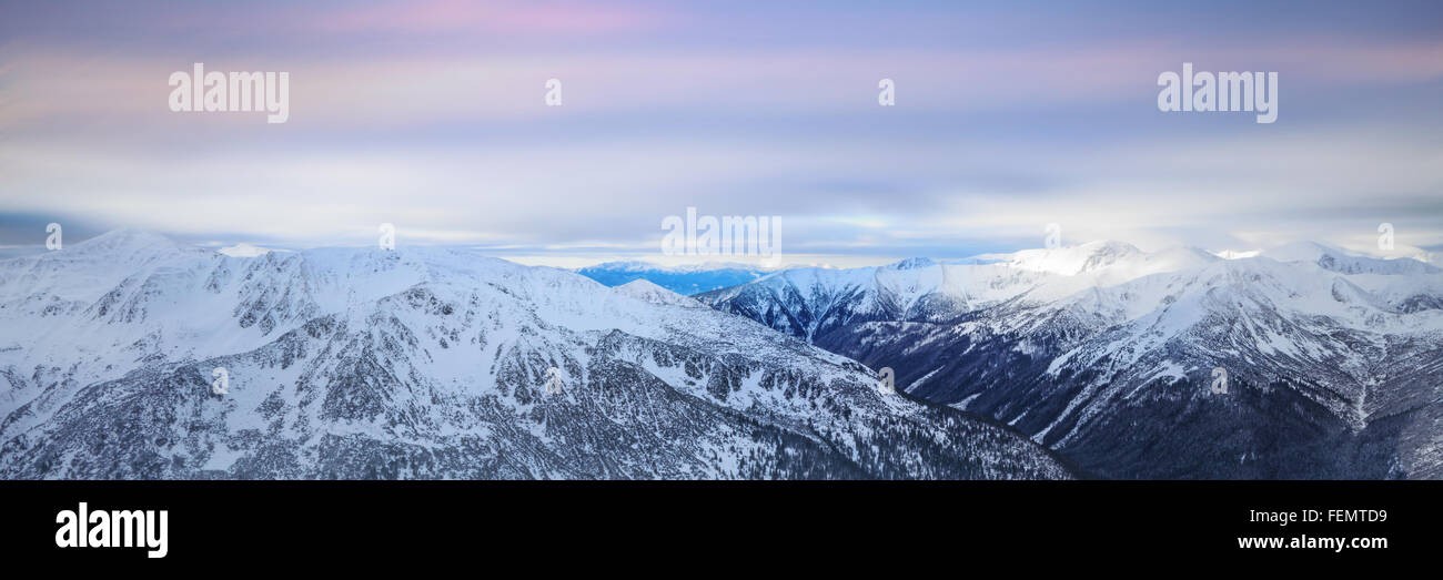 Winter landscape of high snowy mountains Stock Photo