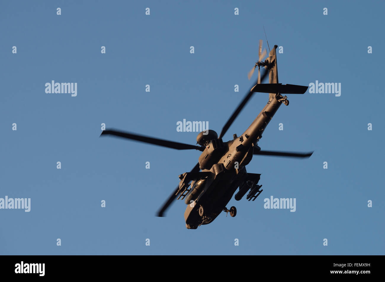 AgustaWestland Apache attack helicopter flown by the British Army Air Corps on a training mission over Woodbridge airfield. Stock Photo