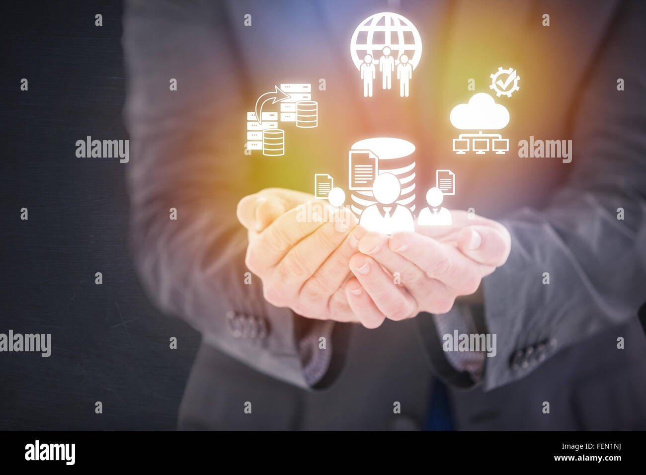 Composite image of handsome businessman presenting with hands Stock Photo