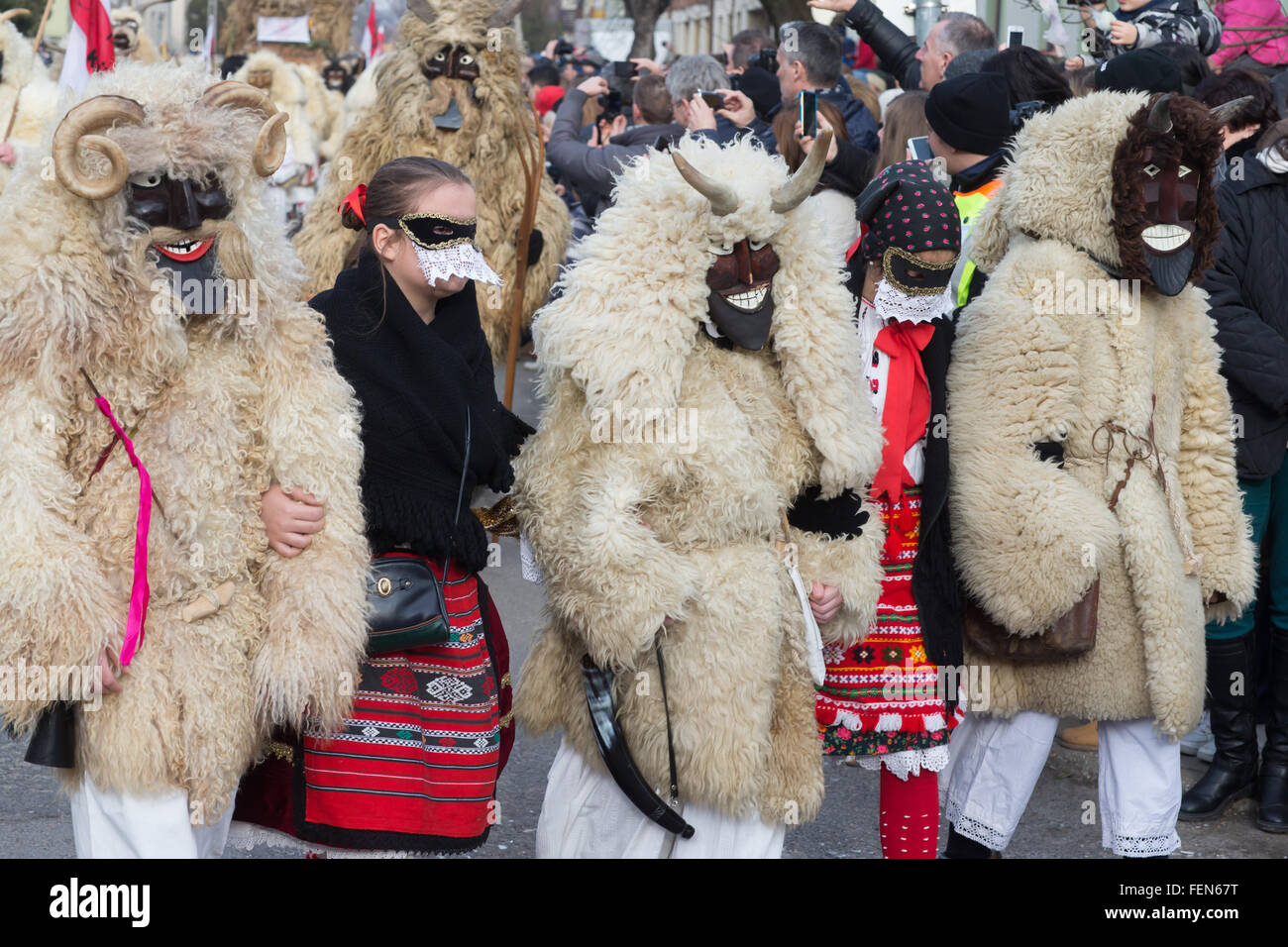 Mohacs, Hungary. 7th Feb, 2016. Masked busos (people wearing sheep fur and wooden masks) take part in the traditional Buso Carnival in Mohacs, southern Hungary, Feb. 7, 2016. The Buso Carnival is an annual celebration of Sokac ethnic group living in Mohacs to bid farewell to winter and welcome spring. According to legend, local people dressed up in sheep fur and wooden masks in a bid to frighten off the Turkish invaders in the 16th century. This year's carnival took place from Feb. 4 till Feb. 9. Credit:  Attila Volgyi/Xinhua/Alamy Live News Stock Photo