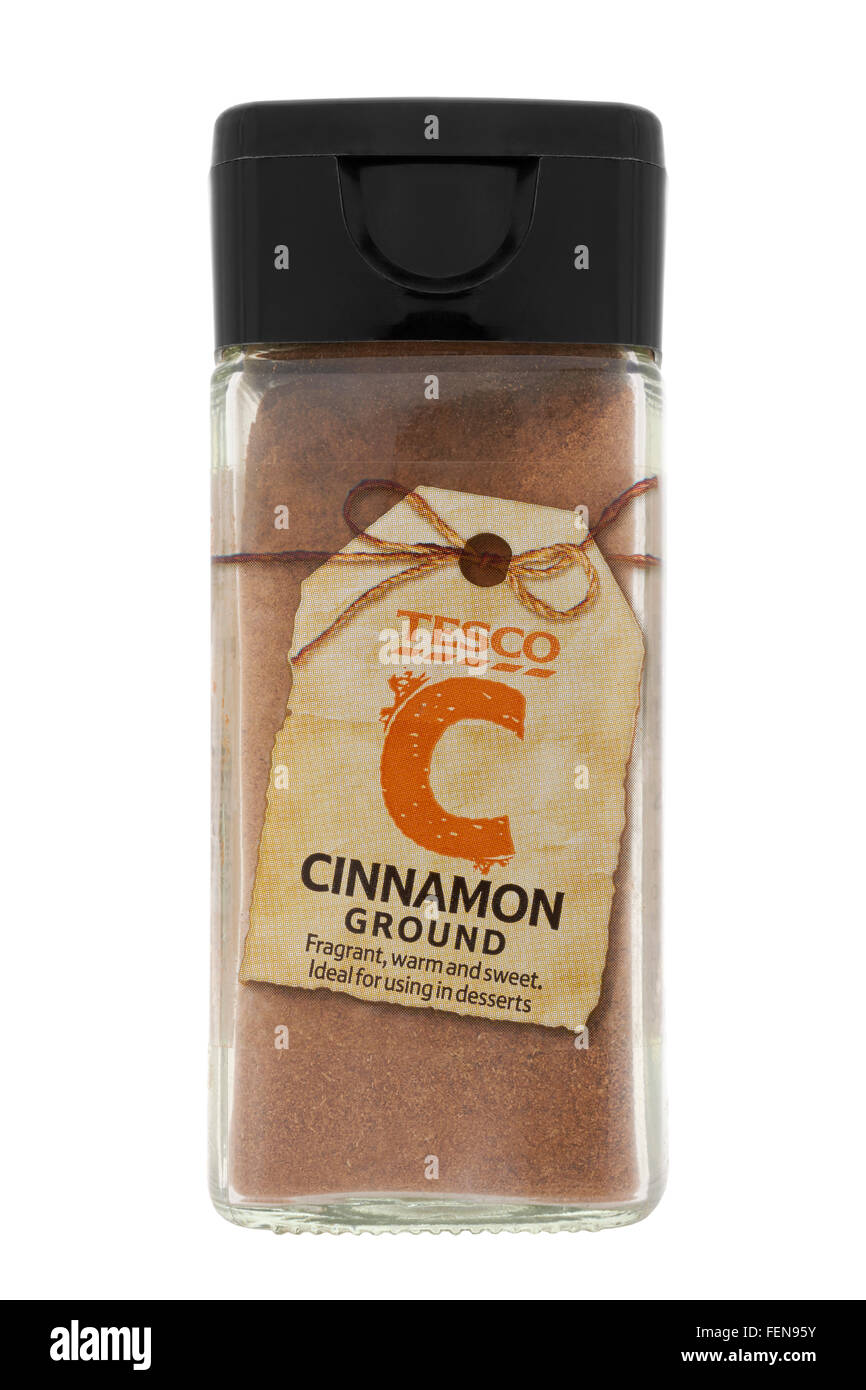 Jar of ground cinnamon on white background Stock Photo