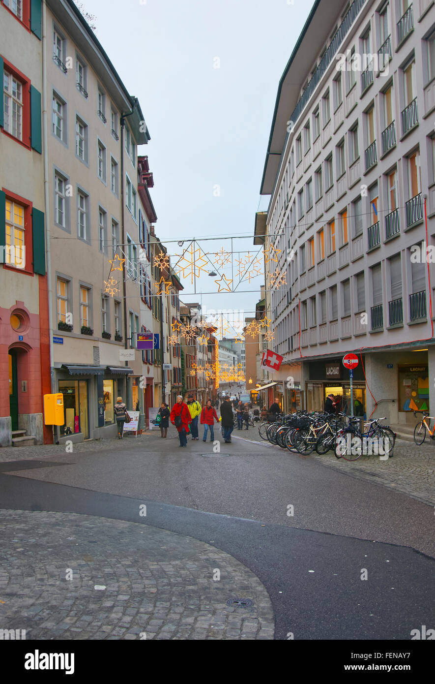 BASEL, SWITZERLAND - JANUARY 1, 2014: Street view with Christmas decoration in Old Town in Basel. Basel is a third most populous city in Switzerland. It is located on the river Rhine. Stock Photo