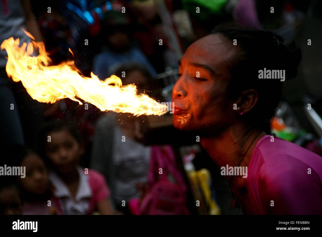 Philippines. 8th Feb, 2016. A fire eater blows fire in Ongpin, Binondo. Thousands joined the Chinese New Year festivities in Binondo, Manila. Binondo is considered to be the oldest Chinatown in the world. © J Gerard Seguia/ZUMA Wire/Alamy Live News Stock Photo