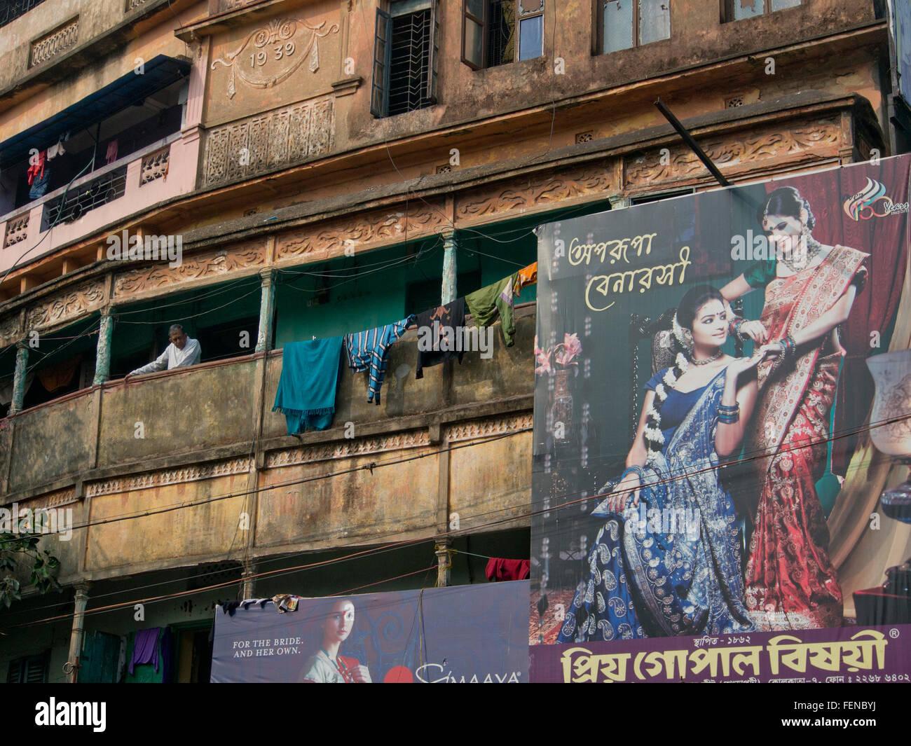 Buildings and fashion hoardings near the  Kalighat temple in Kolkata, India Stock Photo