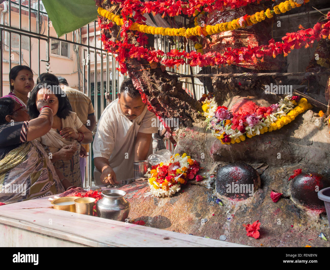 People worship at the Kalighat temple in Kolkata, India Stock Photo