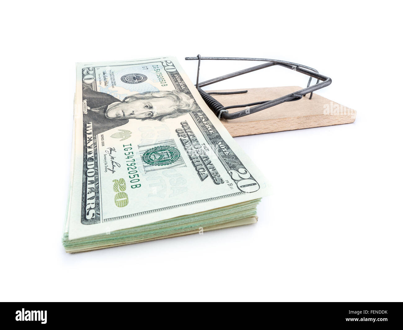 Mouse trap with 20 dollar bill pile attached as bait on whiite background Stock Photo
