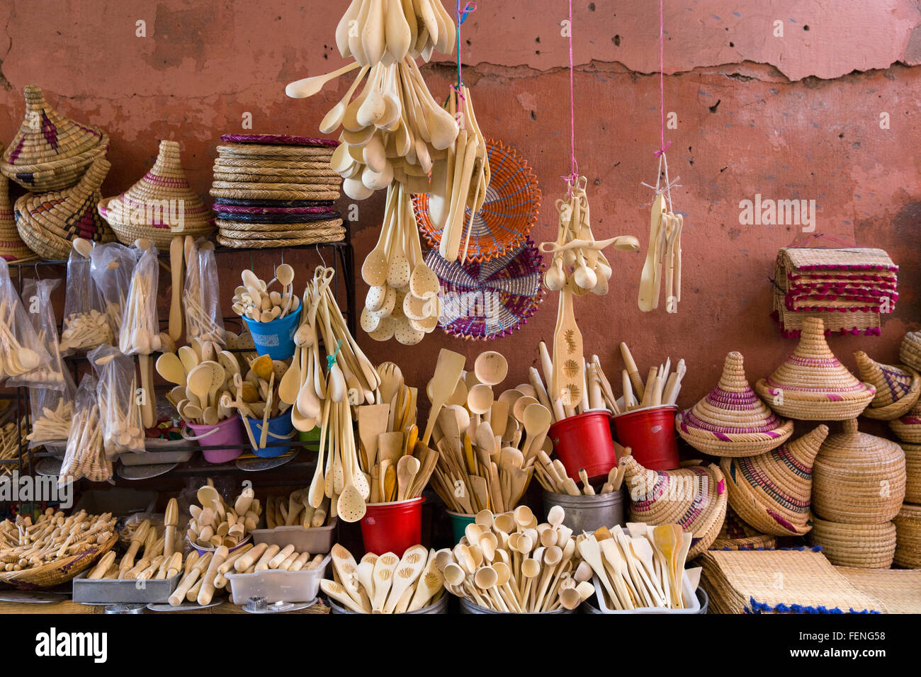 Morocco Marrakech Marrakesh medina Moroccan old souk market wooden handcrafted kitchen utensils for sale Stock Photo