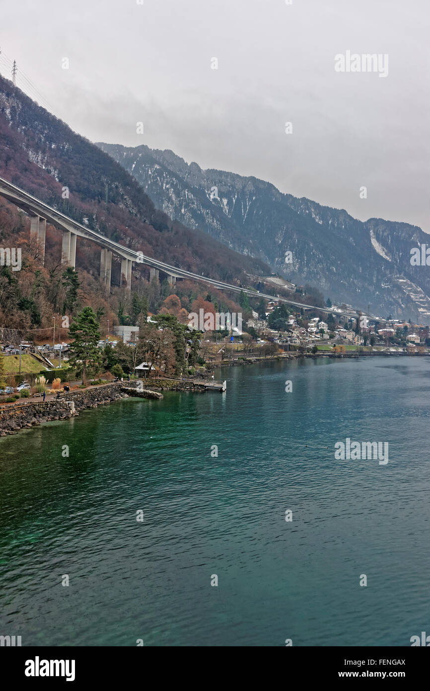 Long bridge above Montreux city center in winter. Montreux is a city in the canton of Vaud in Switzerland. It is located on Lake Geneva at the foot of the Alps. Stock Photo