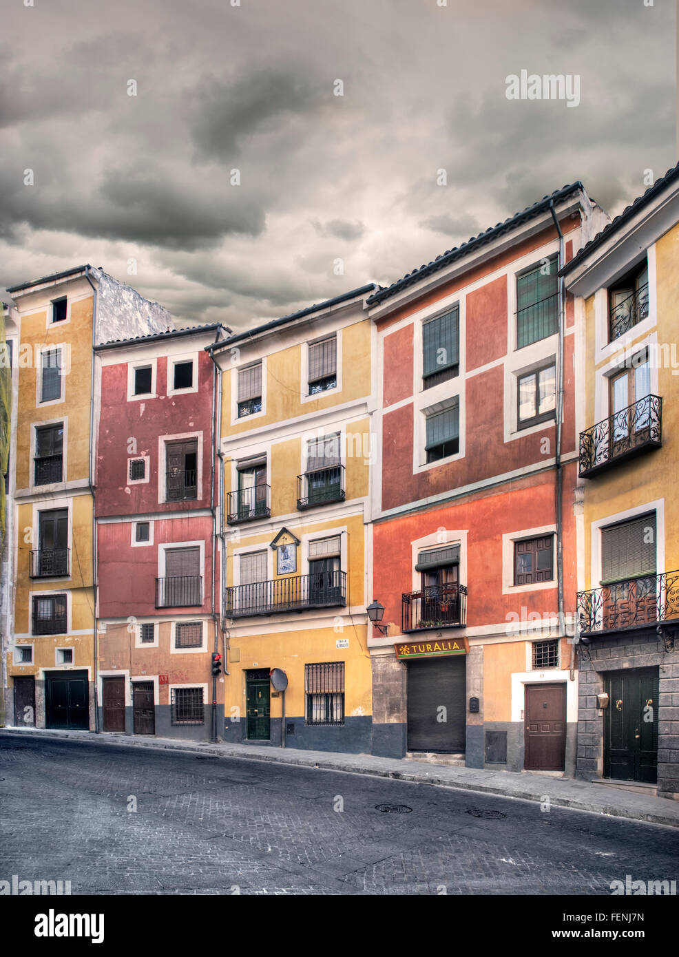 multi-coloured buildings on Calle Alfonso VIII, Cuenca, Spain Stock Photo