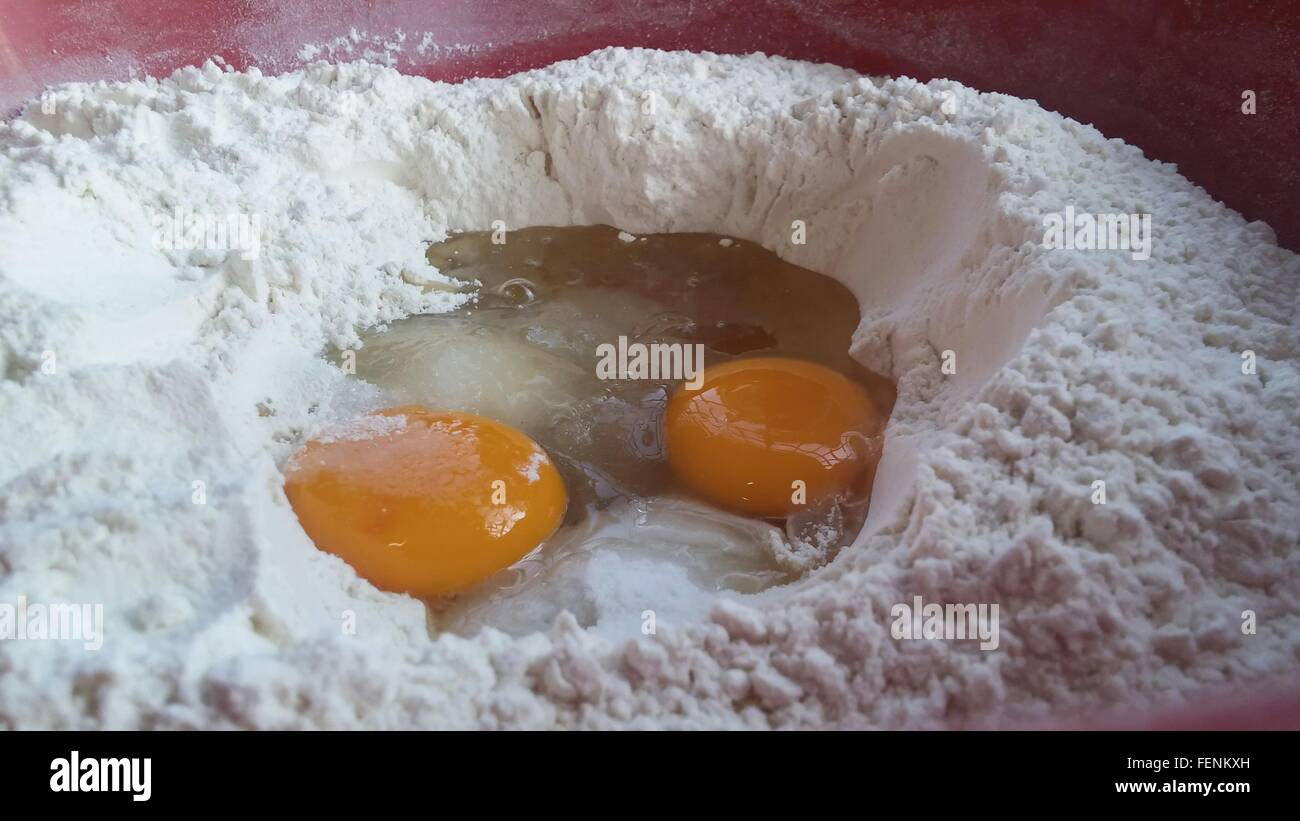 CloseUp Of Egg Yolk In Flour Stock Photo Alamy