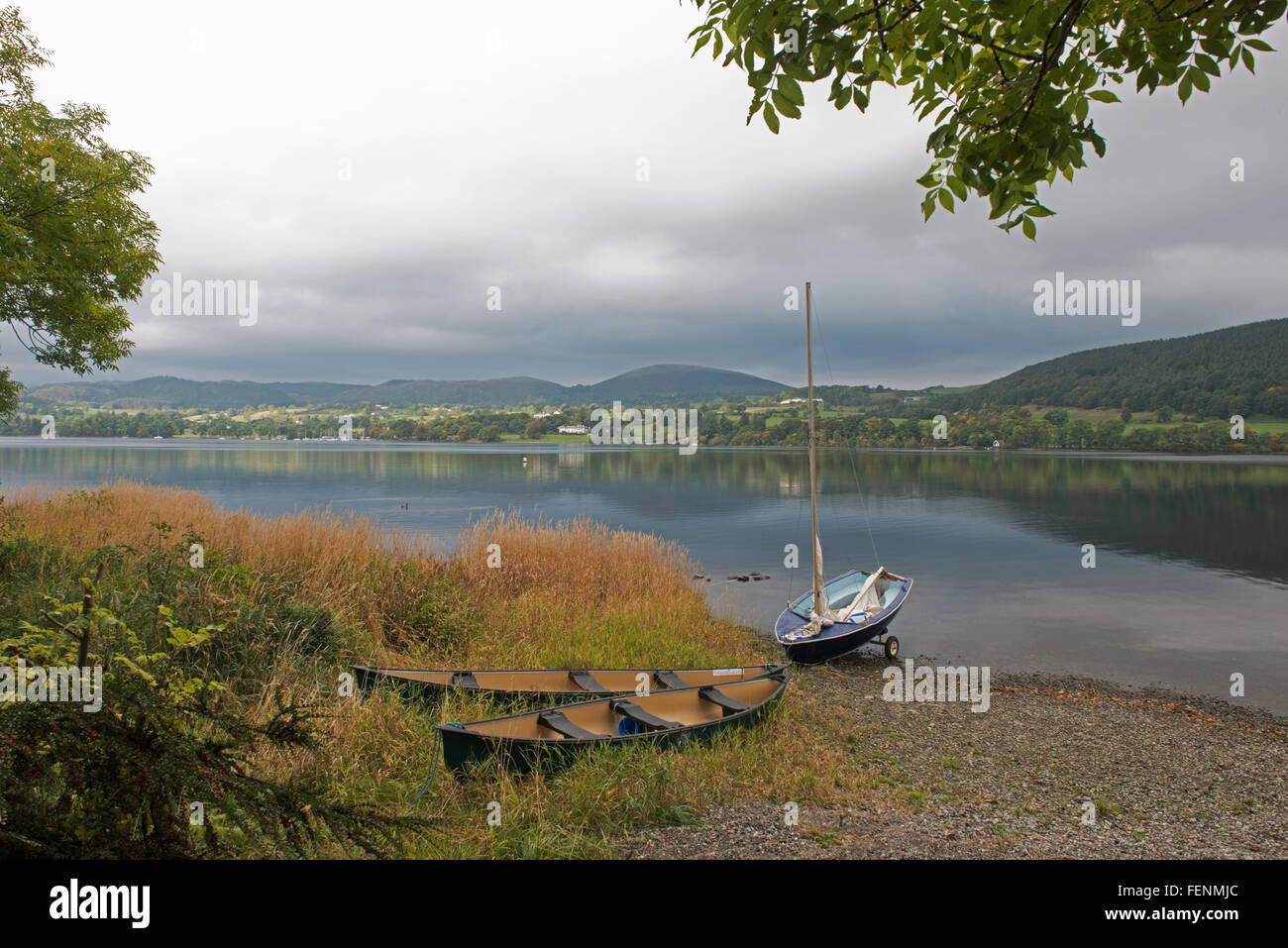 Canoes and Small Sailing Boat on Ullswater Lake, Pooley Bridge, Penrith, Lake District National