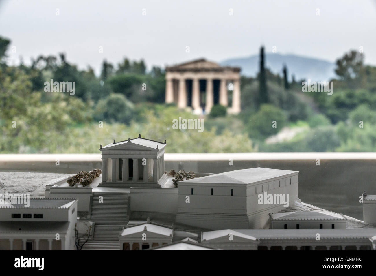 The Temple of Hephaestus behind a model of itself in the Ancient Agora of Athens Museum. Stock Photo