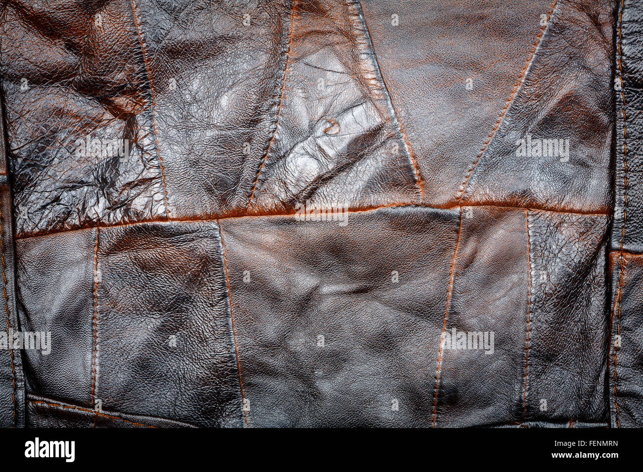 Crumpled brown leather patchwork fabric texture background Stock Photo