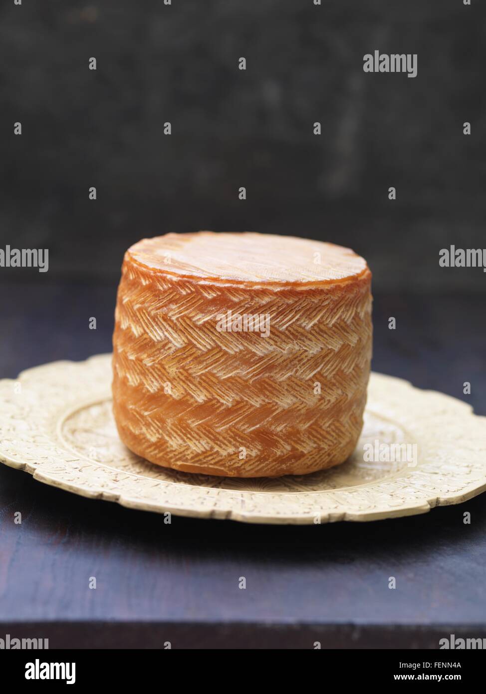 Whole manchego cheese on plate Stock Photo Alamy