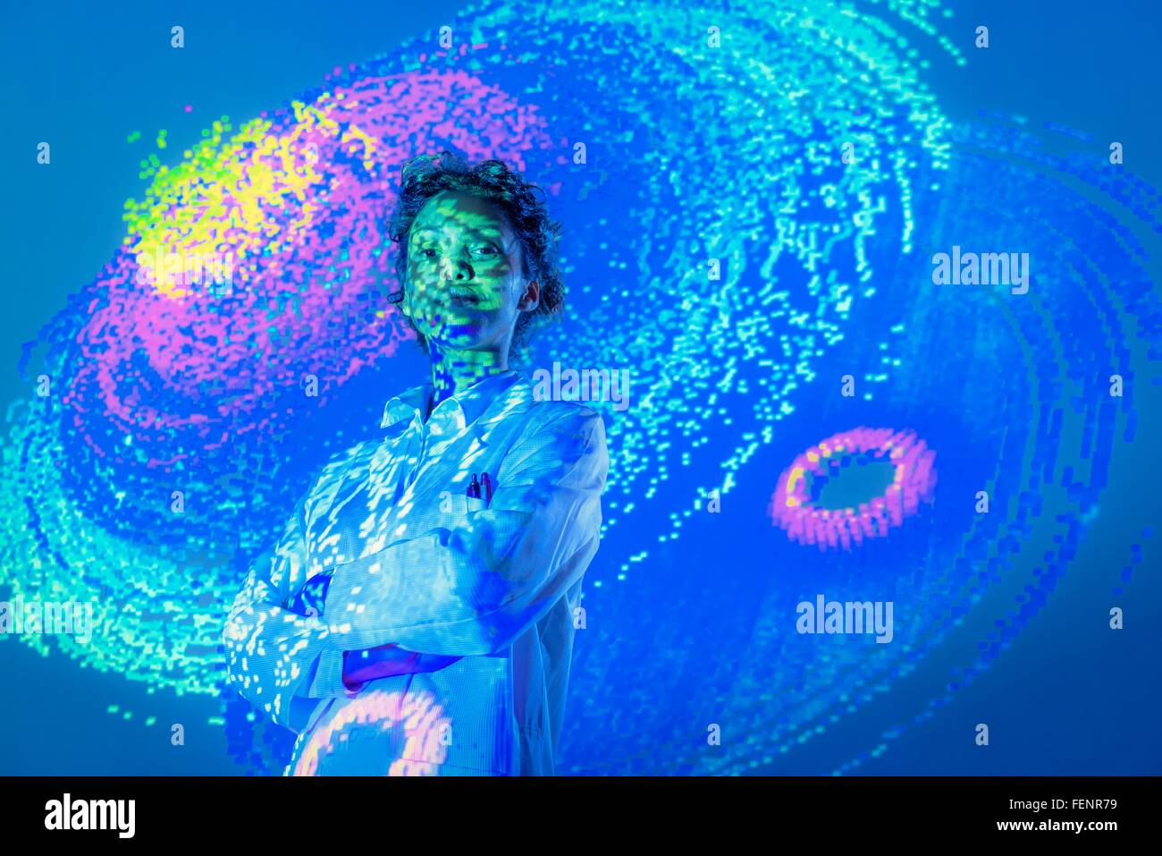 Portrait of female scientist with graphical data projection Stock Photo
