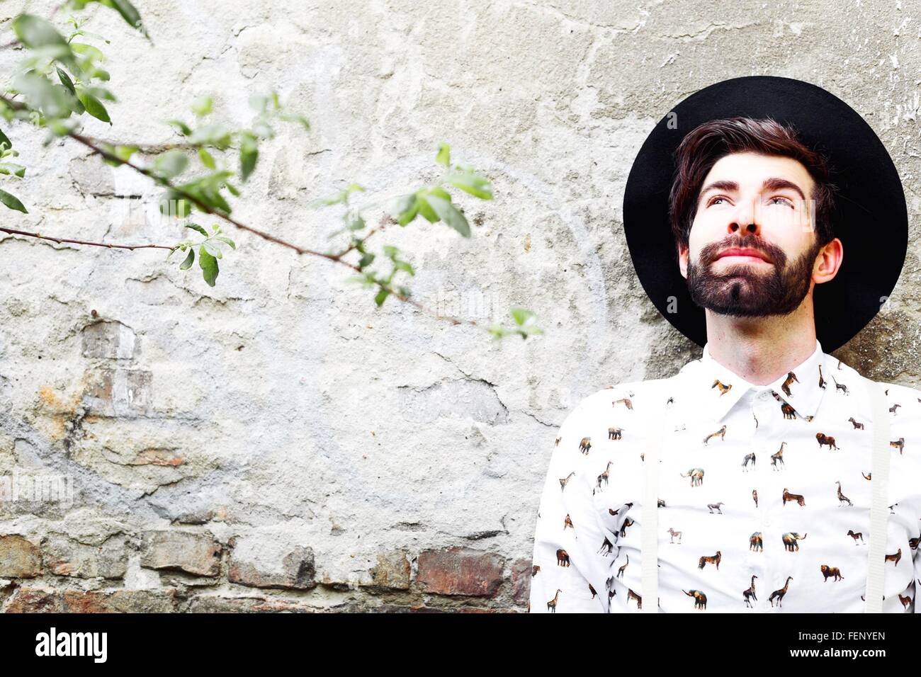 Man Wearing Hat Looking Up Stock Photo