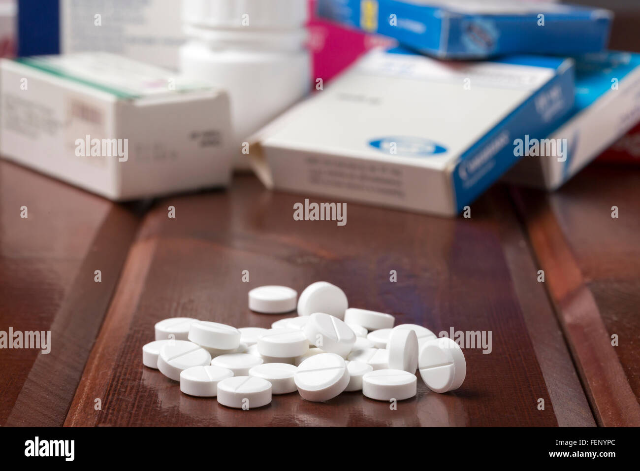 White round pills and various pill boxes Stock Photo