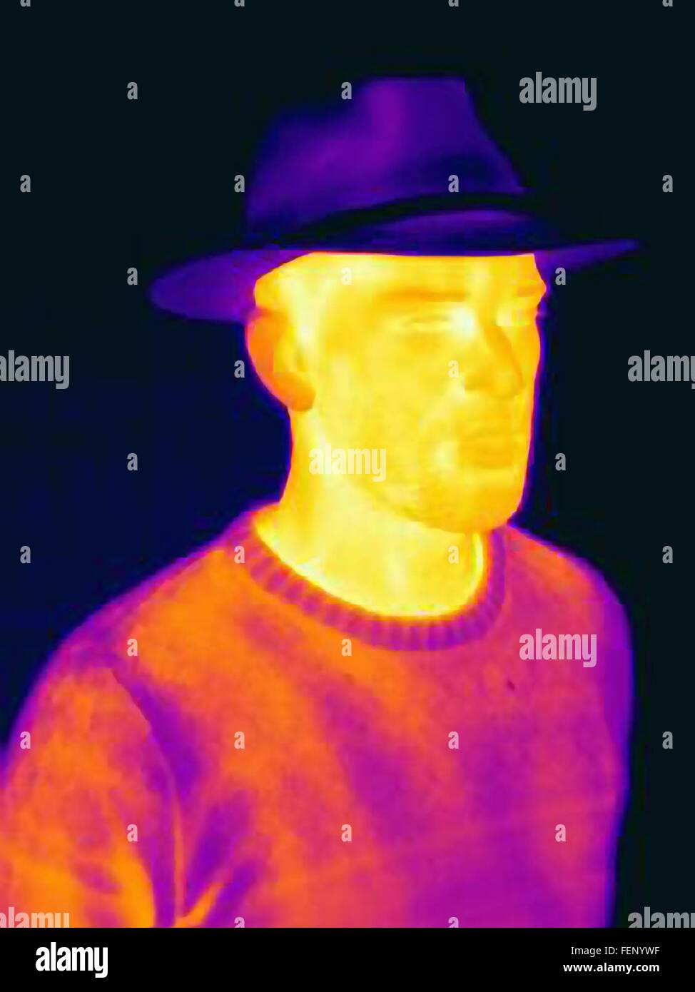 Thermal image of man wearing face mask panama hat Stock Photo