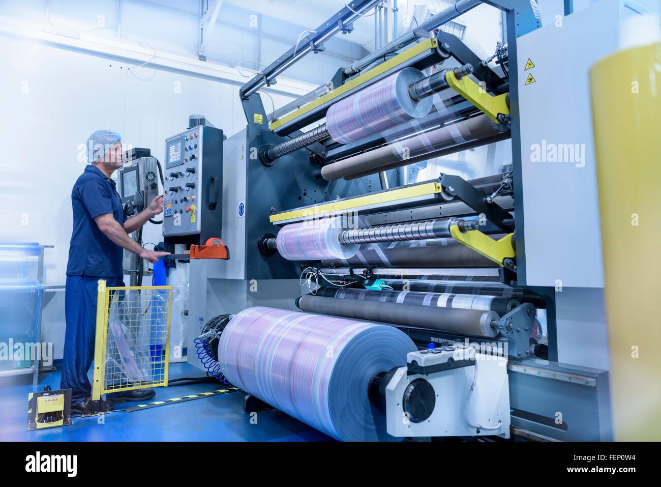 Operator and printing machine in food packaging printing factory Stock  Photo - Alamy