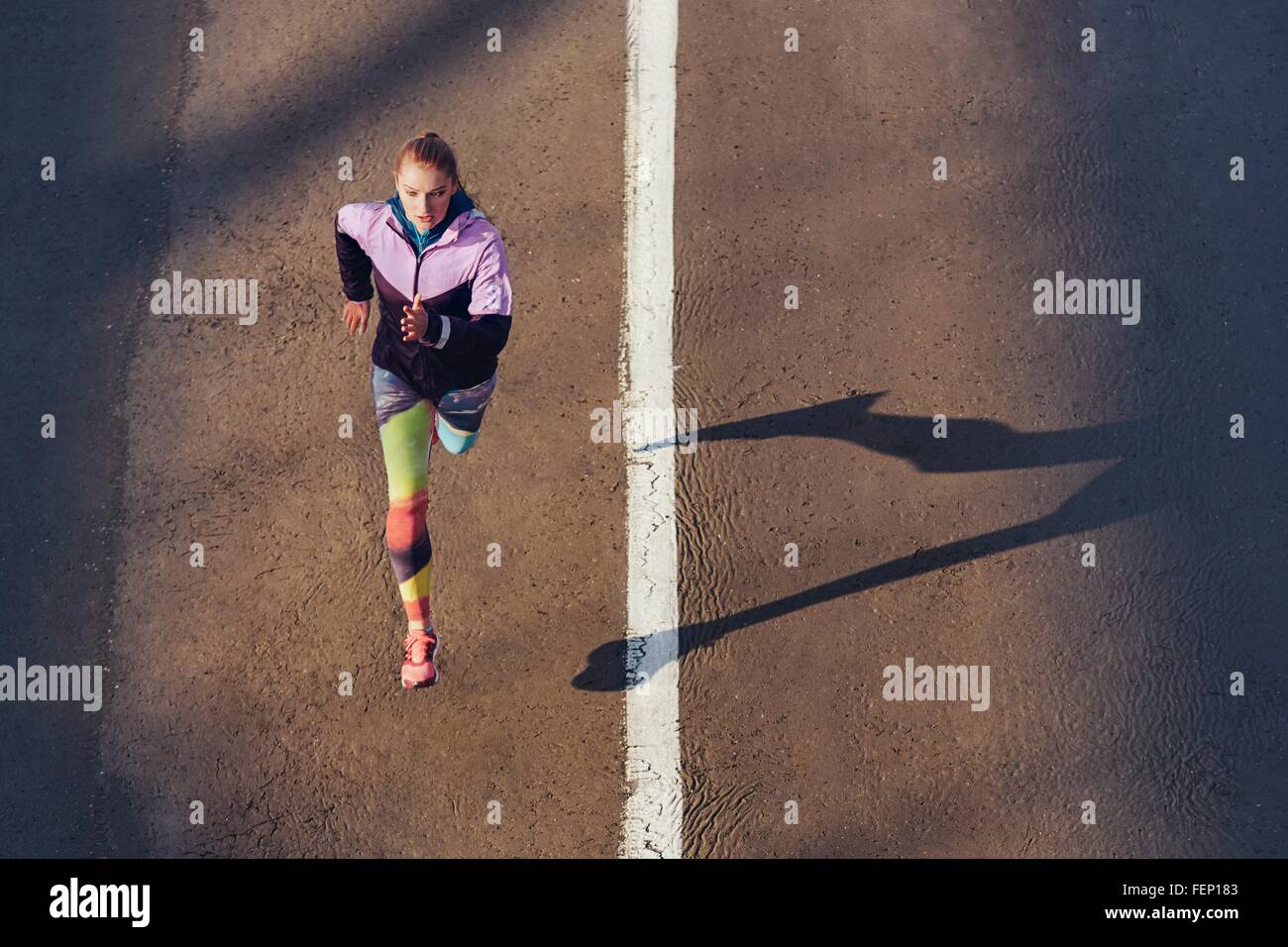 High angle view of female runner running on city road Stock Photo Alamy