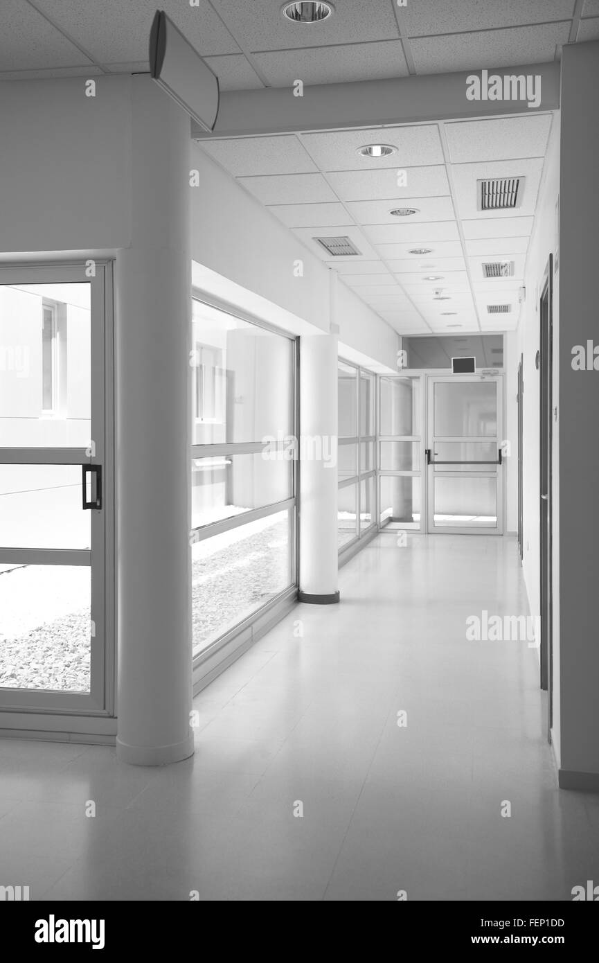 Modern building interior with exit door. Vertical Stock Photo - Alamy