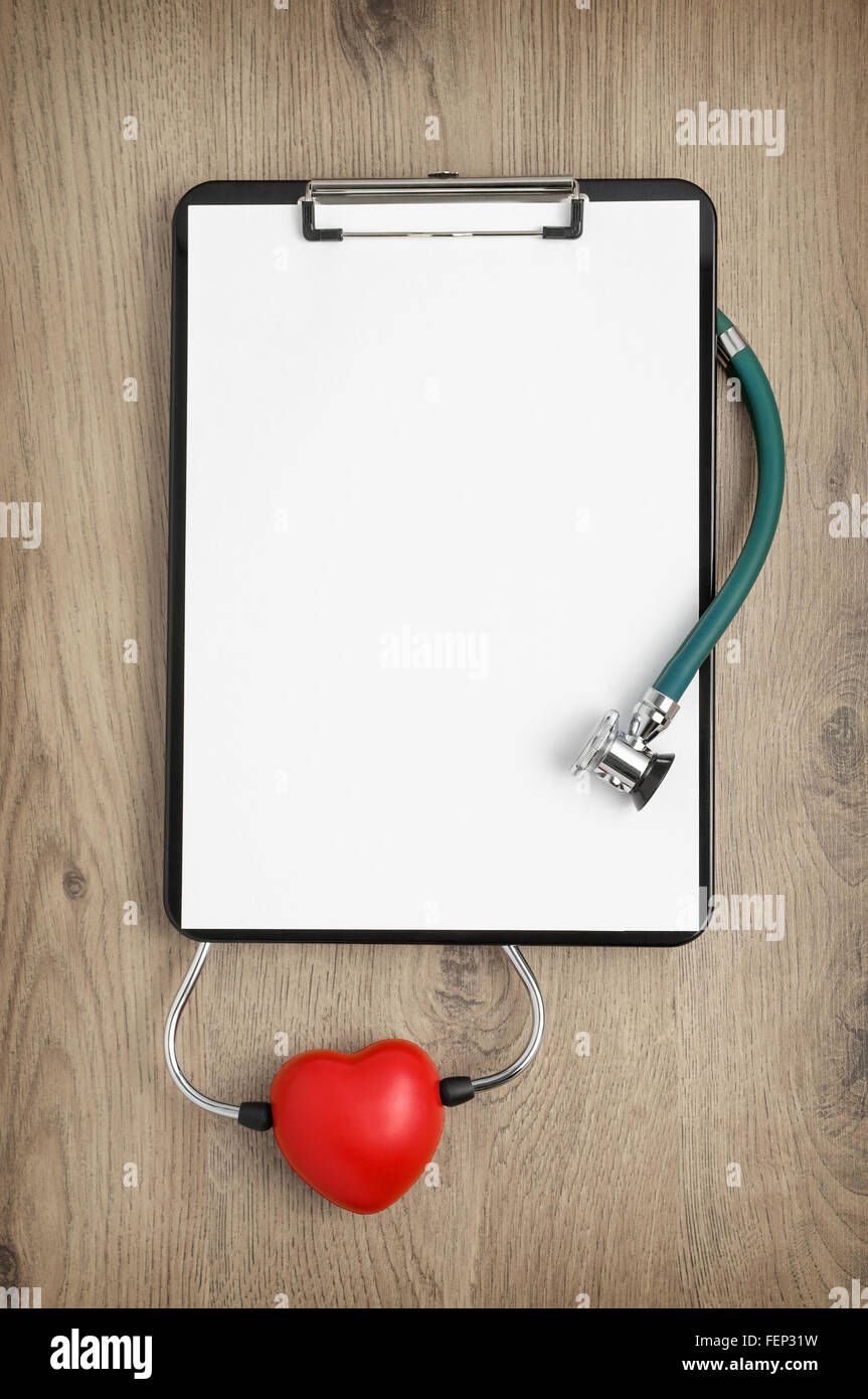 Clipboard with blank white paper, stethoscope and heart shape on wooden ...