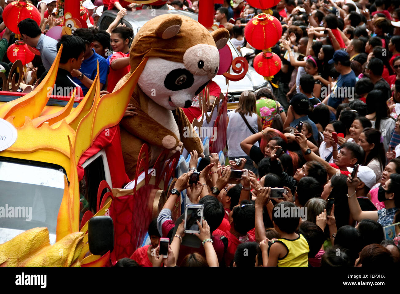 Manila, Philippines. 08th Feb, 2016. A panda mascot wearing a monkey costume, pose for the crowd in Ongpin, Binondo. Thousands joined the Chinese New Year festivities in Binondo, Manila. Binondo is considered to be the oldest Chinatown in the world. © J Gerard Seguia/Pacific Press/Alamy Live News Stock Photo