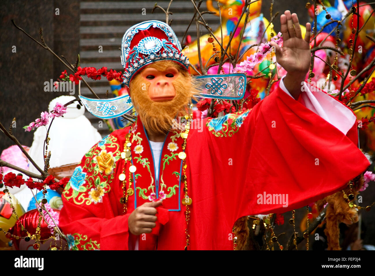 Manila, Philippines. 08th Feb, 2016. Aman wearing a monkey costume waves to the crowd in Ongpin, Binondo. Thousands joined the Chinese New Year festivities in Binondo, Manila. Binondo is considered to be the oldest Chinatown in the world. © J Gerard Seguia/Pacific Press/Alamy Live News Stock Photo