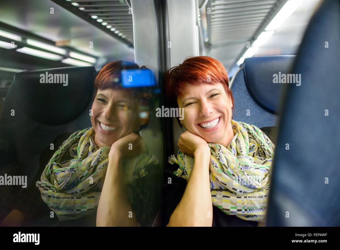 Woman sitting on train hi-res stock photography and images - Alamy