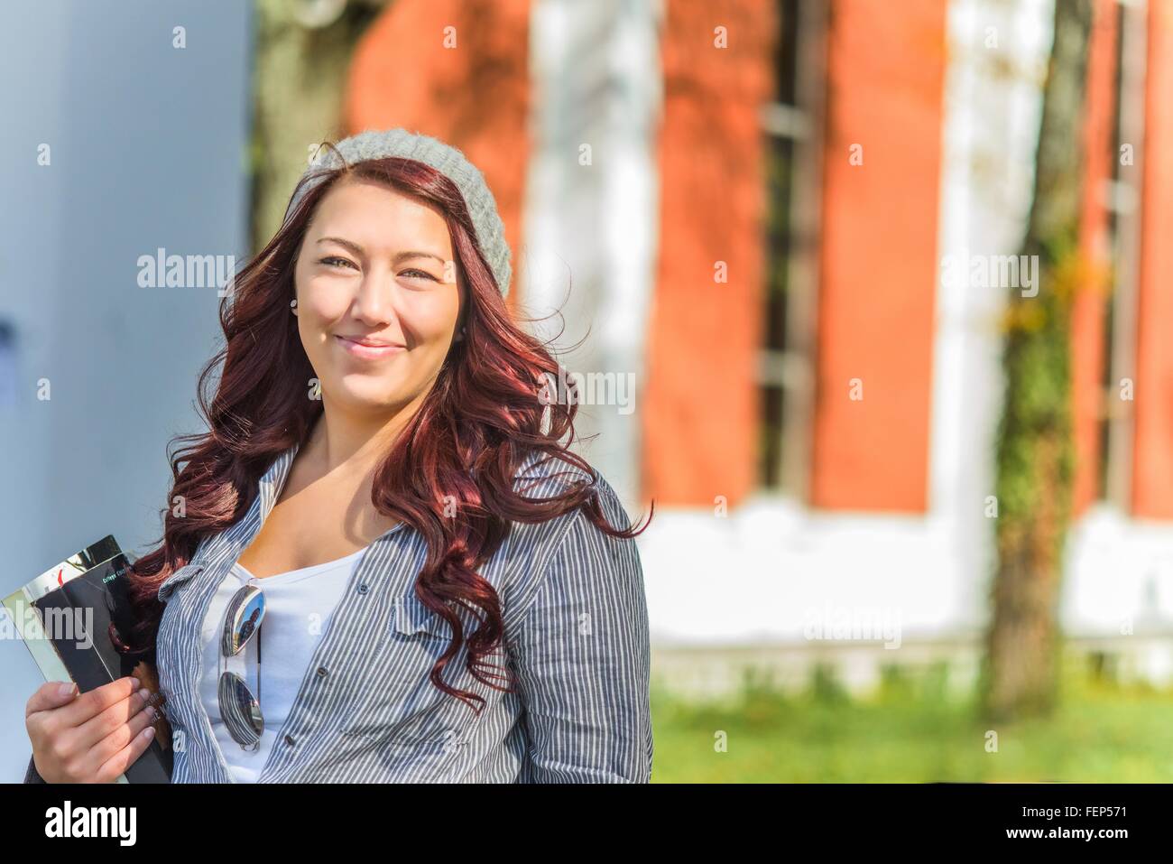 Portrait of adult female college student on campus Stock Photo
