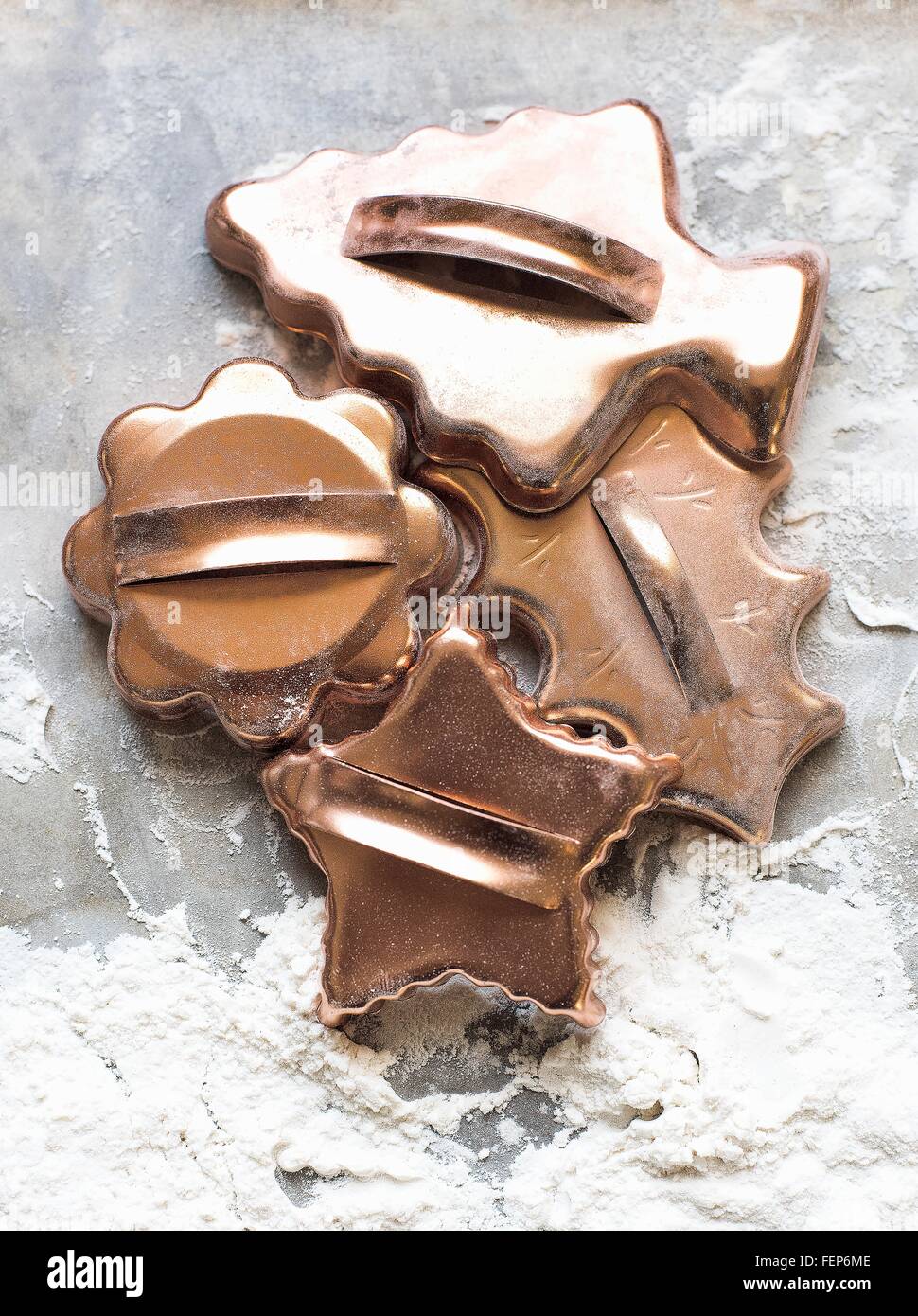 Overhead view of selection of gold colour Christmas cookie cutters Stock Photo