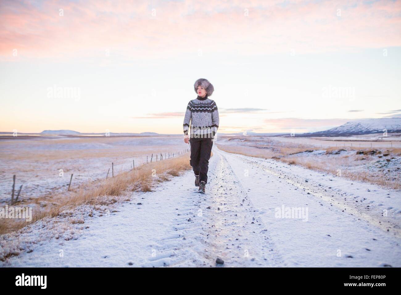 Woman walking on country road hi-res stock photography and images - Alamy