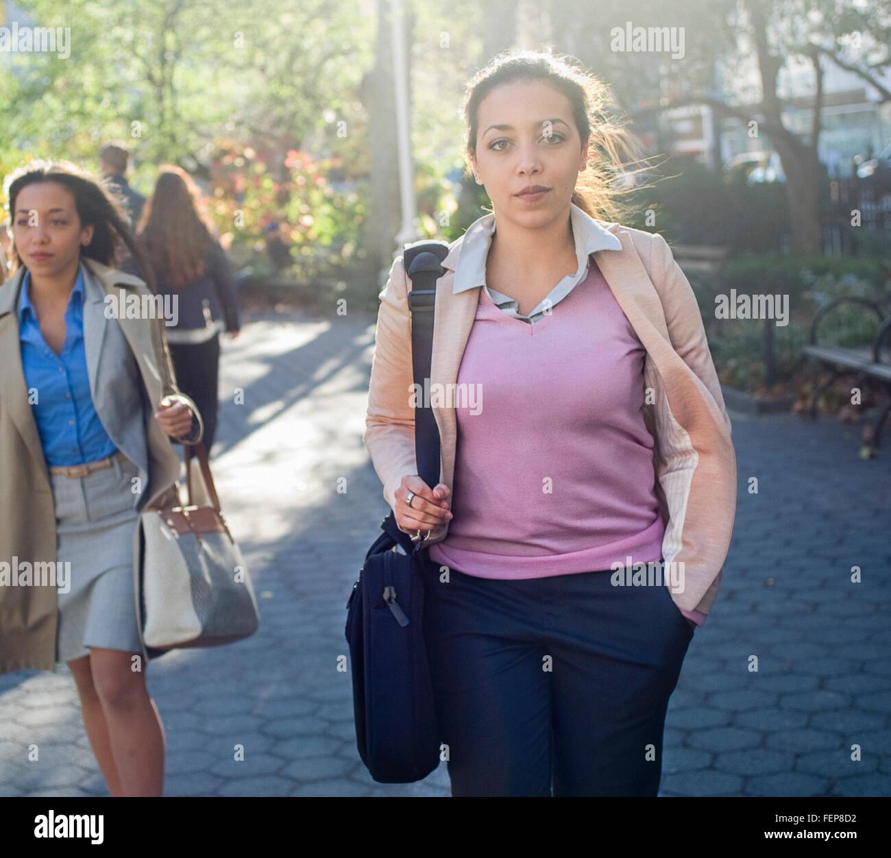 Woman walking through the park hi-res stock photography and images - Alamy