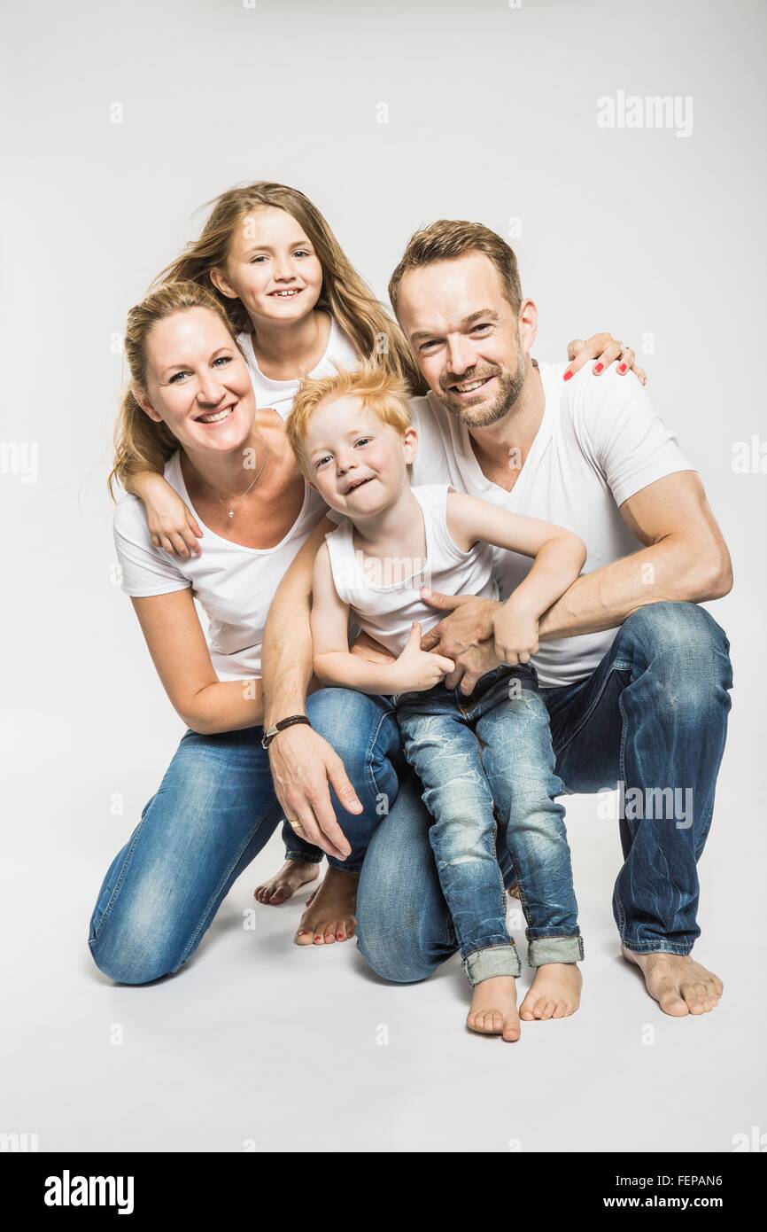 Studio portrait of mature couple with son and daughter Stock Photo