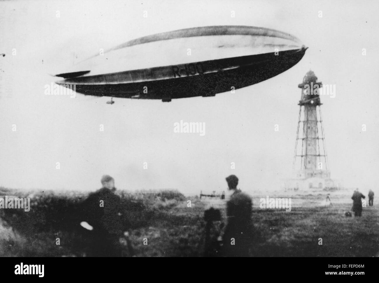 The R-100, a British airship, is seen moored to a mast in this historic ...