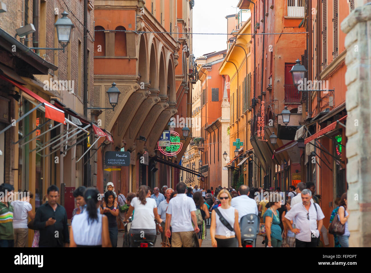 Bologna old town, view of a busy shopping street scene in the Via