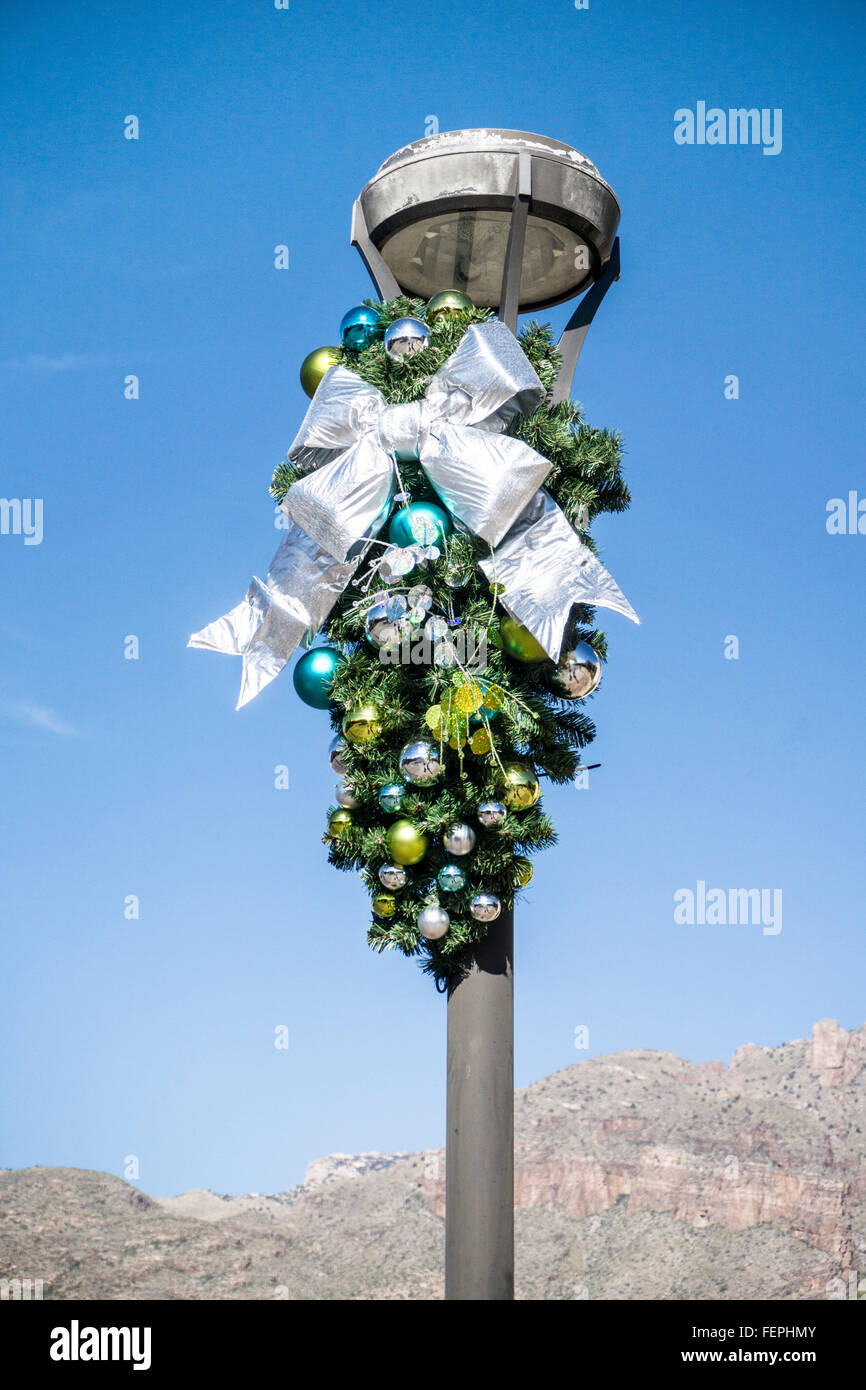 Shopping Center Lamp Posts Seen Against Mountains With Christmas
