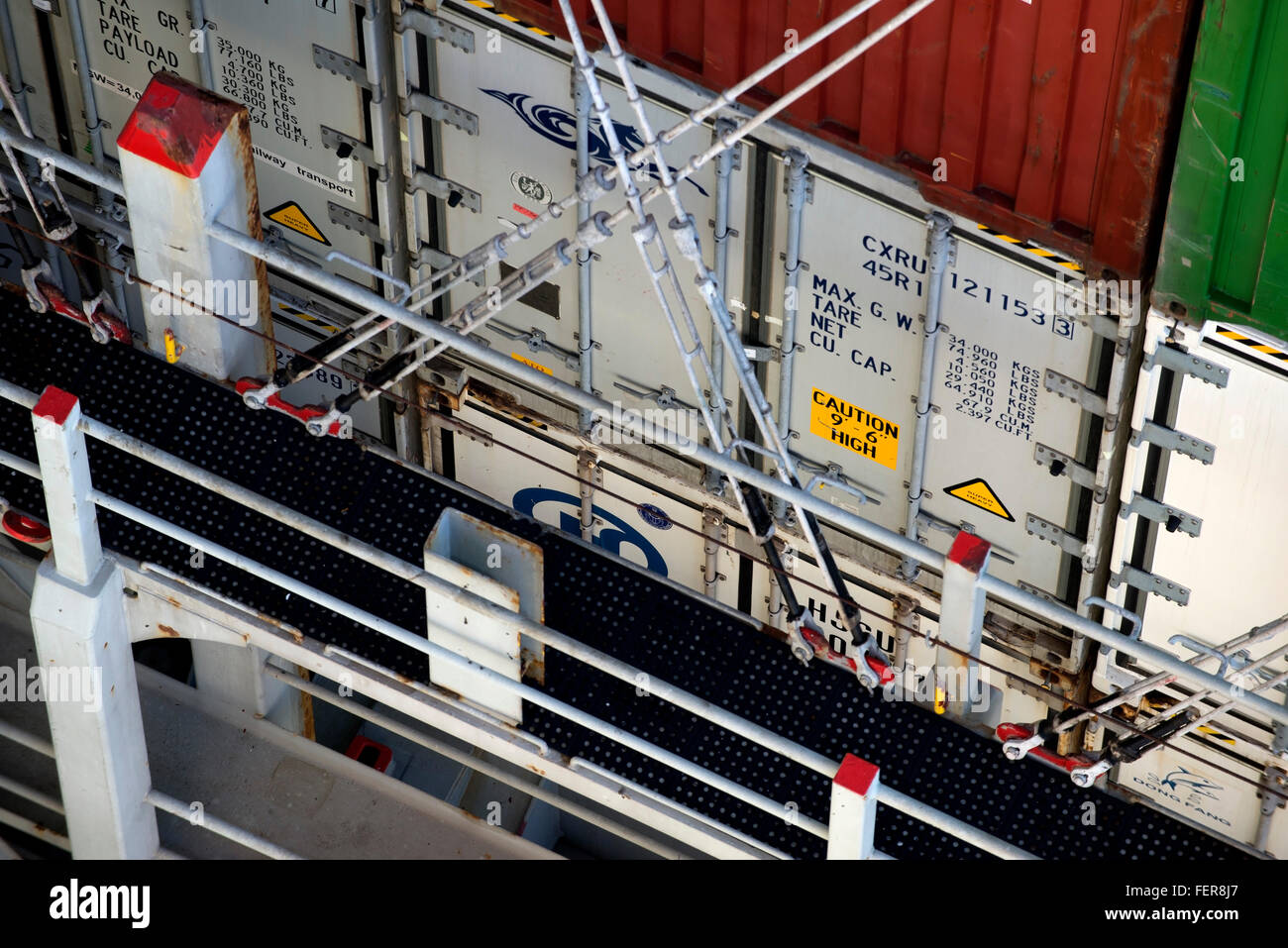 Container shipments. Rods lashed to the vessel secure containers on