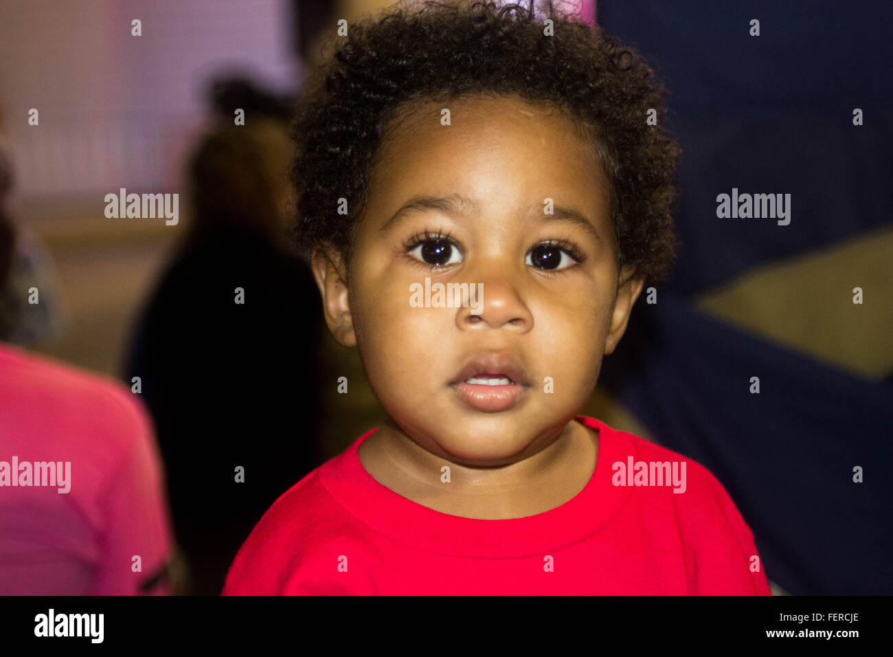 A little boy in red shirt at a park Stock Photo