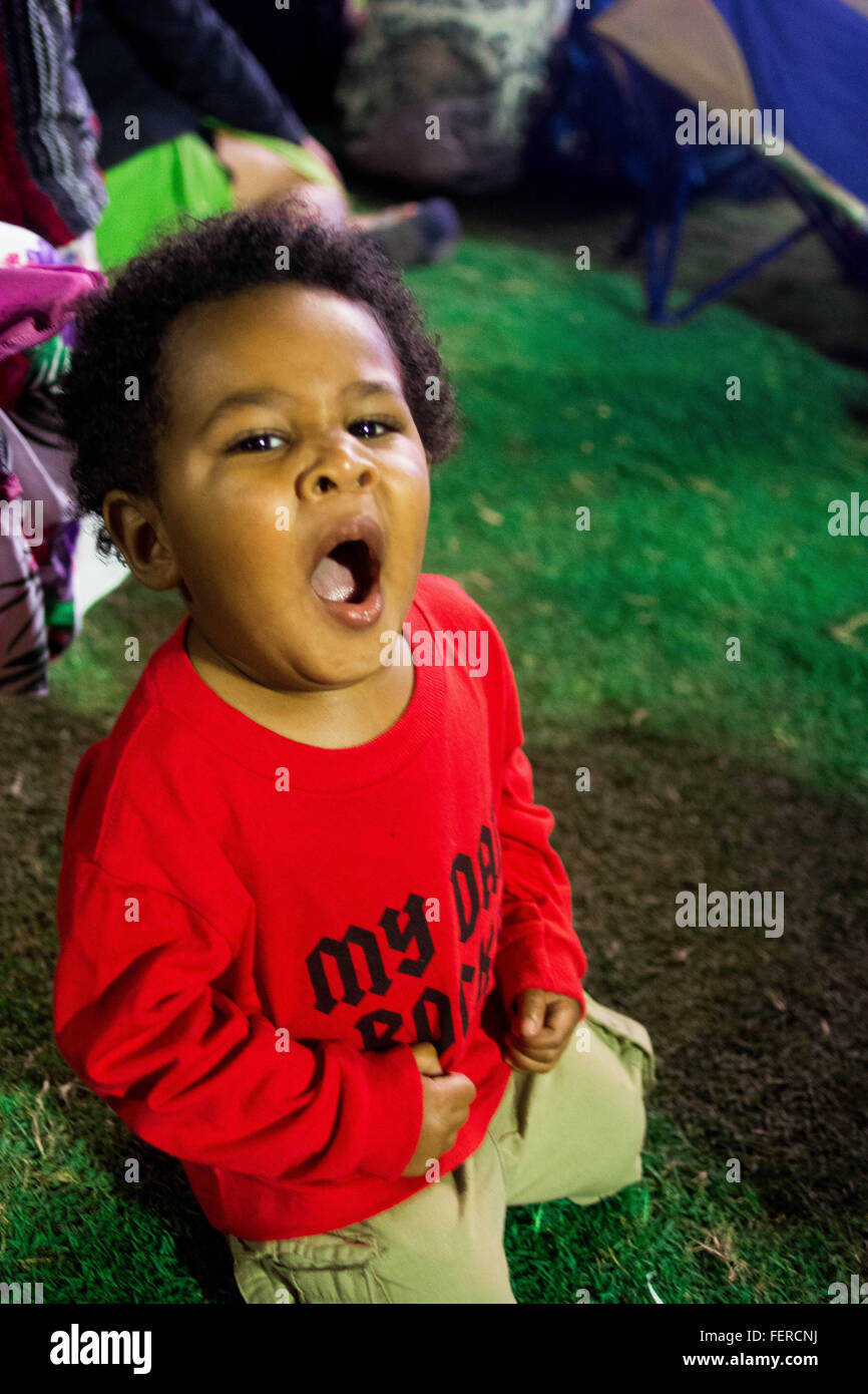 A little boy yawning Stock Photo