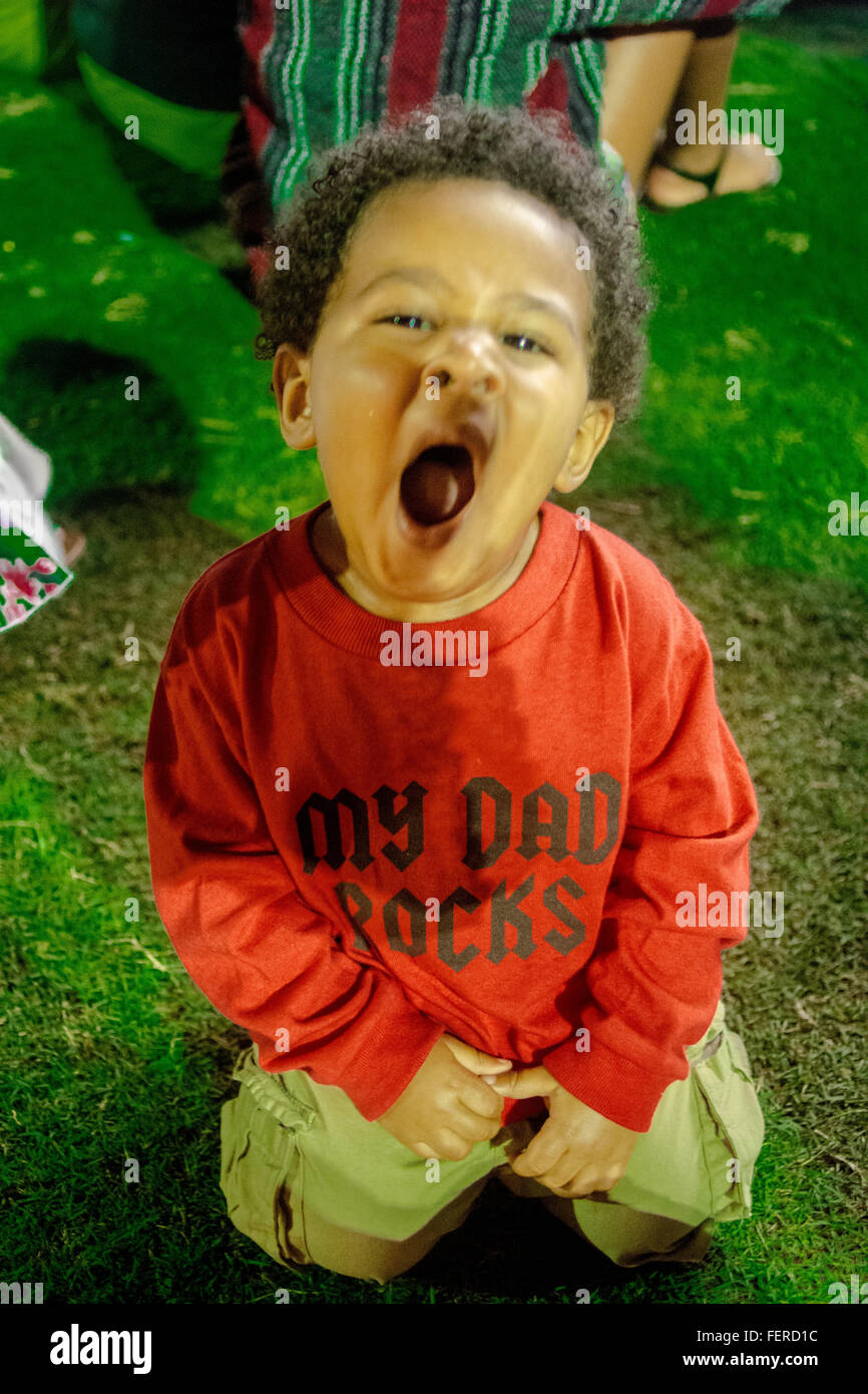 A little boy yawning Stock Photo