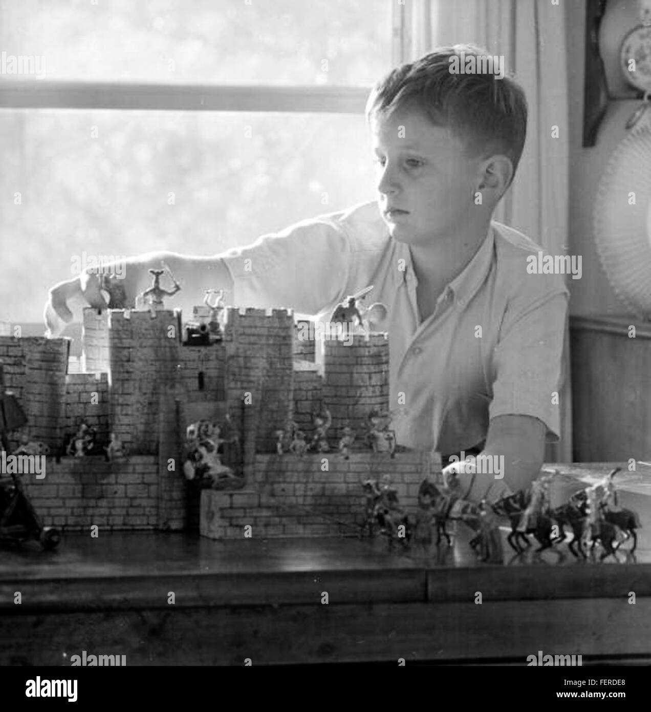 Boy with castle and toy soldiers - Tallahassee Boy with castle and toy soldiers - Tallahassee Stock Photo