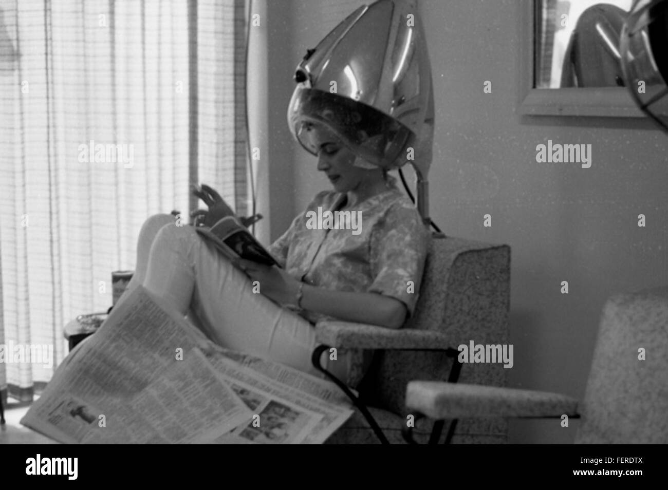 Woman Under Hair Dryer At A Beauty Shop In Tallahassee Stock Photo
