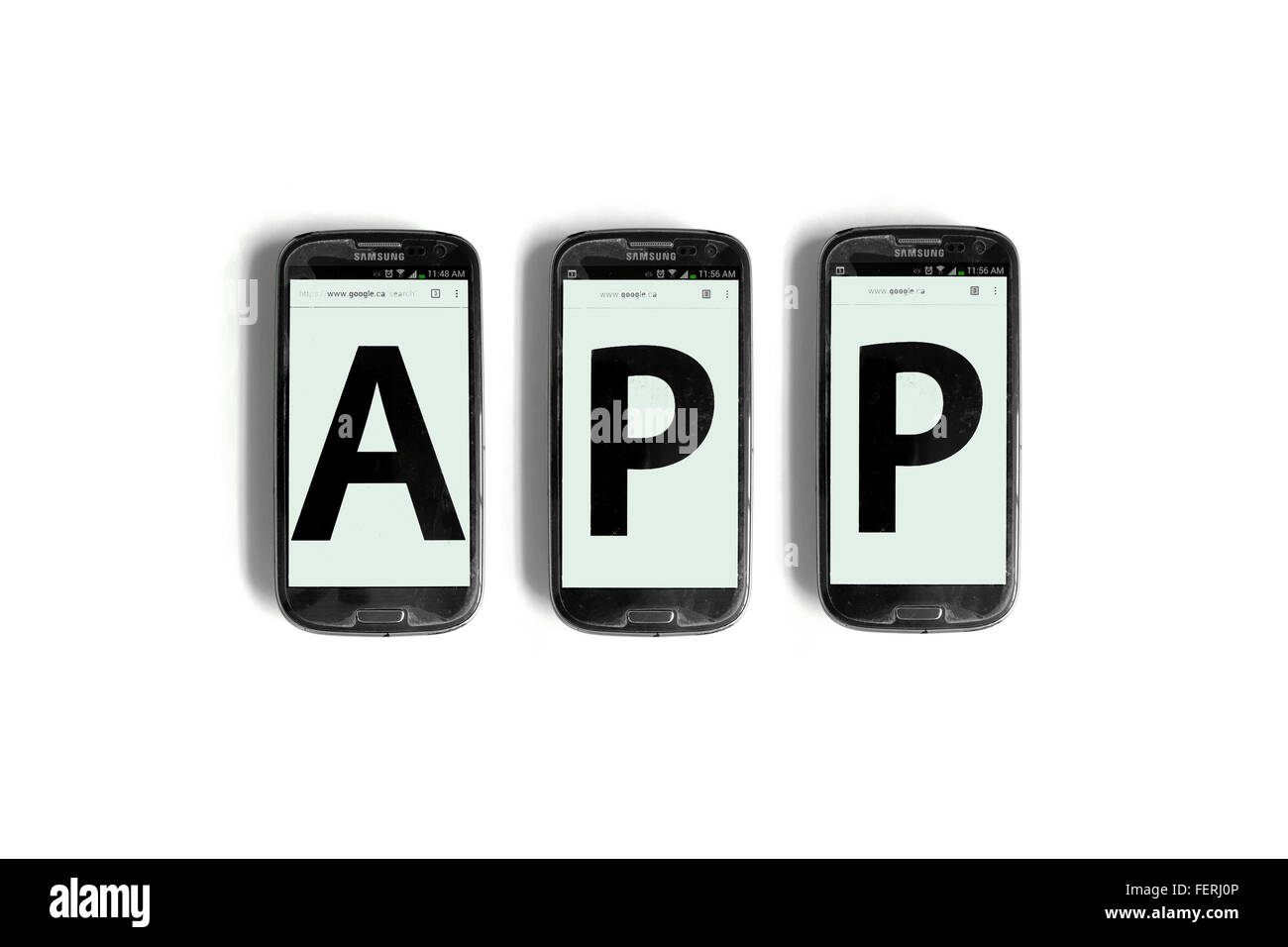 App on the screens of smartphones photographed against a white background. Stock Photo