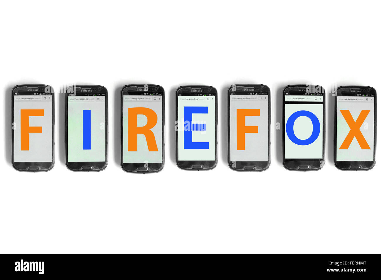 Firefox on the screens of smartphones photographed against a white background. Stock Photo